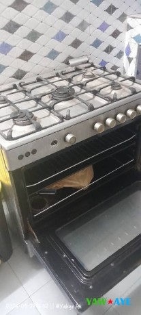 cuisinez-comme-un-chef-gaziniere-electrique-5-feux-avec-four-en-excellent-etat-big-0