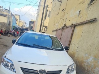 toyota-corolla-2009-blanche-climatisee-etat-a-revoir