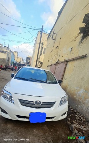 toyota-corolla-2009-blanche-climatisee-etat-a-revoir-big-1